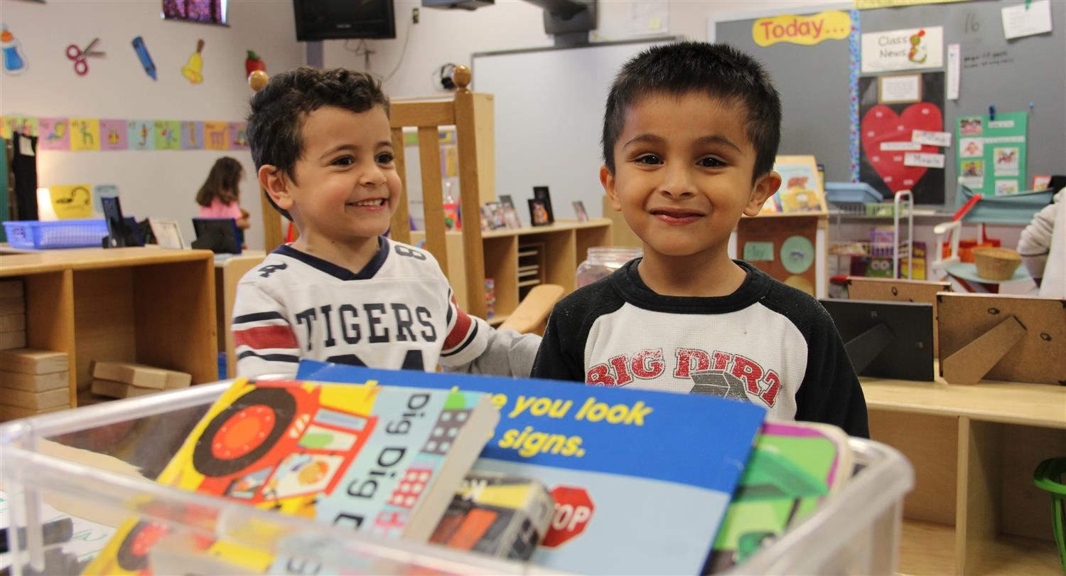 Two preschool boys smiling 